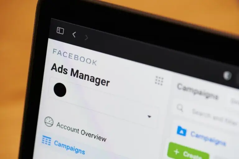 Close-up view of a tablet screen displaying the Facebook Ads Manager interface, with options for managing campaigns and an account overview